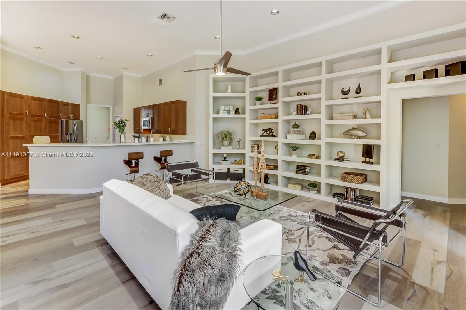 300 Mallard Road Weston, FL 33327 - Photo 22 of 46 a living room with furniture and a flat screen tv