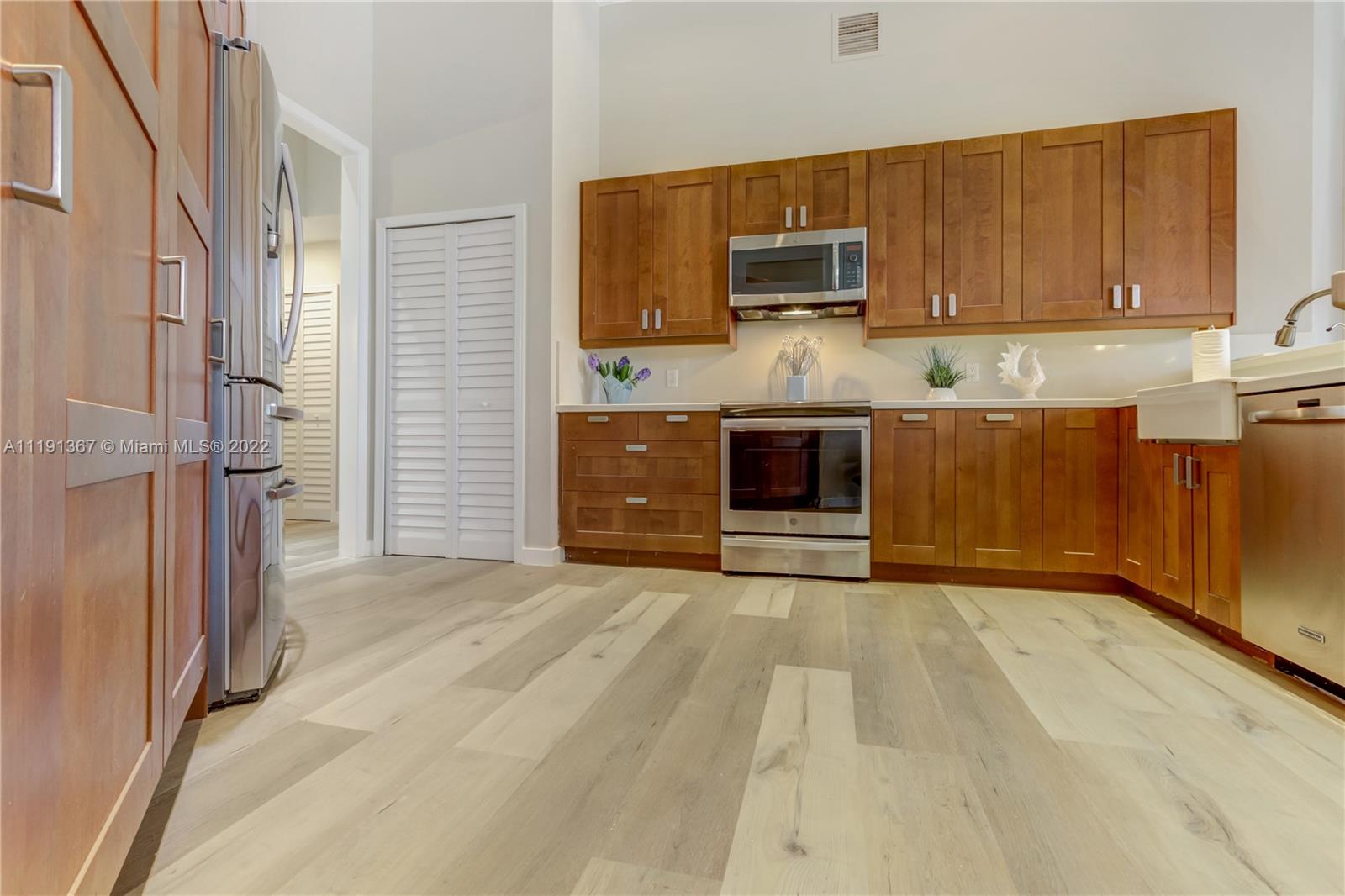 300 Mallard Road Weston, FL 33327 - Photo 25 of 46 a view of kitchen with stainless steel appliances granite countertop a stove refrigerator and microwave