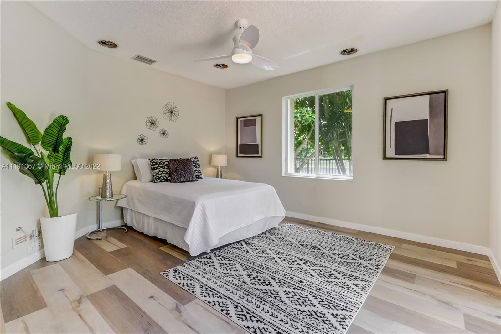 300 Mallard Road Weston, FL 33327 - Photo 26 of 46 a bedroom with a large bed and a window