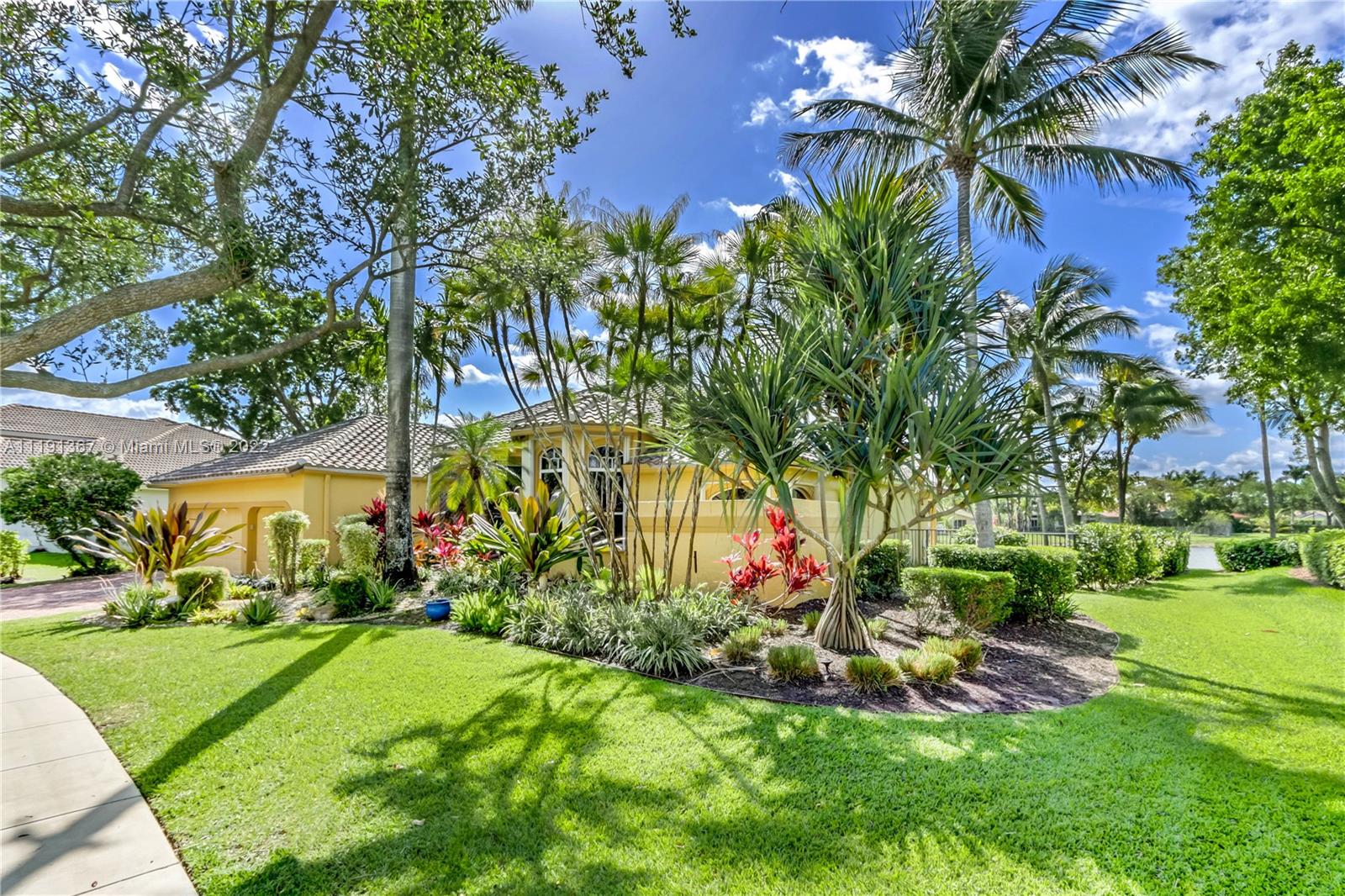 300 Mallard Road Weston, FL 33327 - Photo 3 of 46 a view of a garden with a building in the background