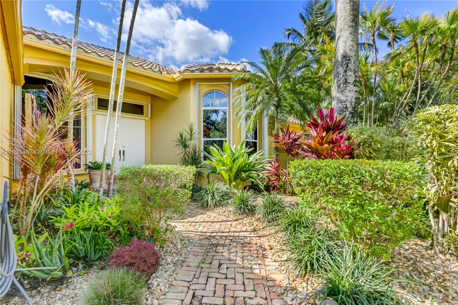 300 Mallard Road Weston, FL 33327 - Photo 4 of 46 a front view of a house with a yard