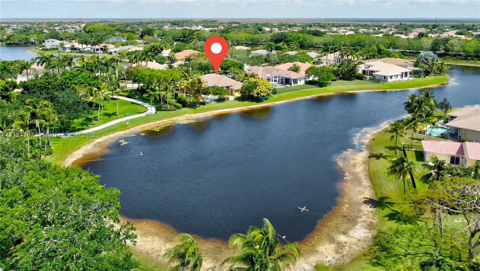 300 Mallard Road Weston, FL 33327 - Photo 42 of 46 an aerial view of a house with a yard and lake view