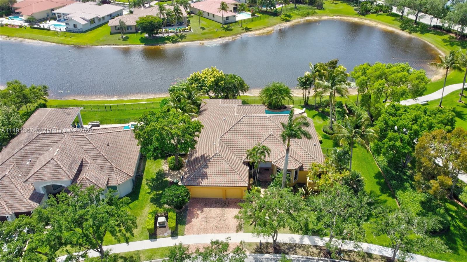 300 Mallard Road Weston, FL 33327 - Photo 46 of 46 an aerial view of a house with a yard and a lake view