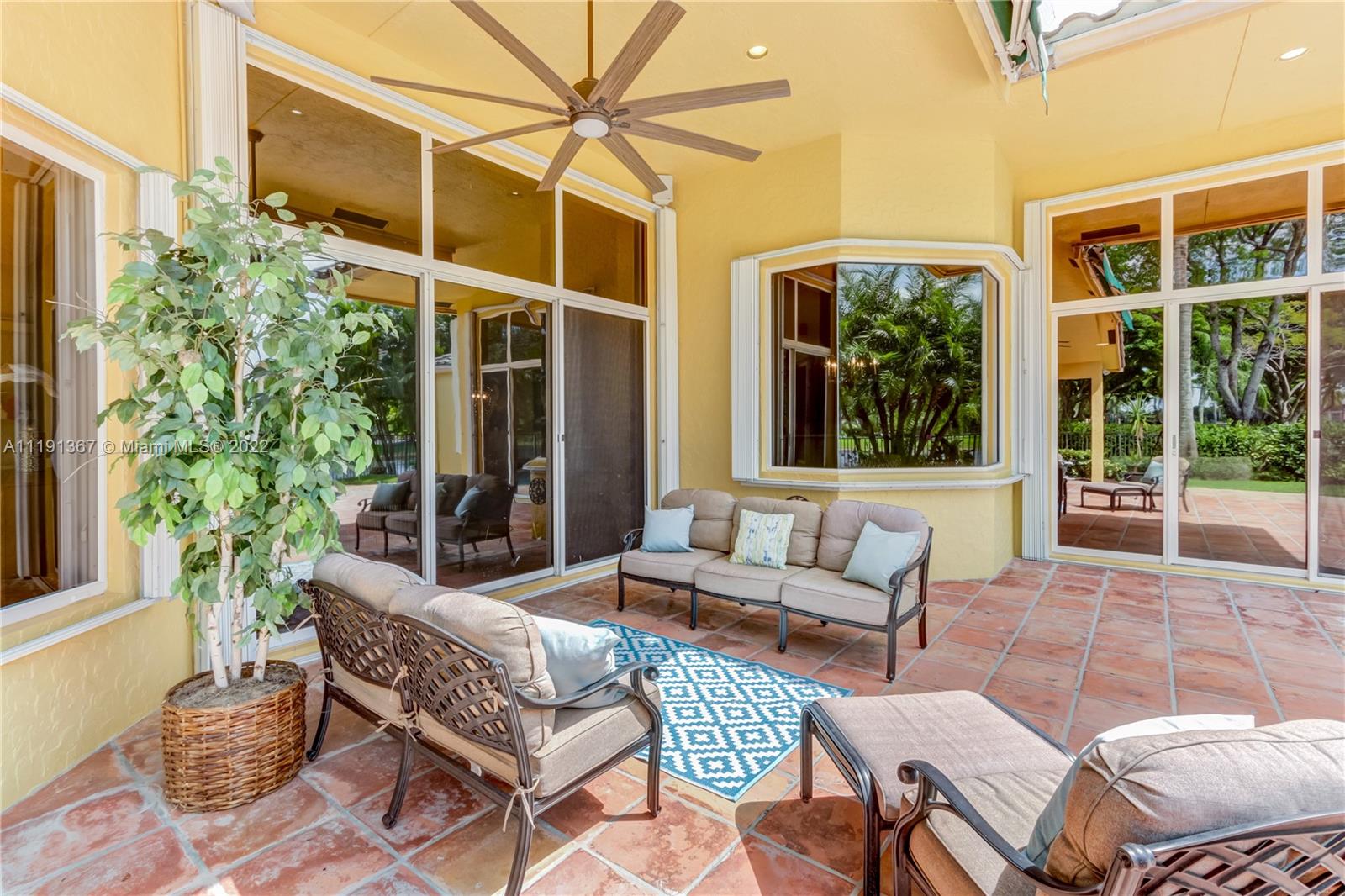 300 Mallard Road Weston, FL 33327 - Photo 7 of 46 a outdoor living space with furniture and a potted plant