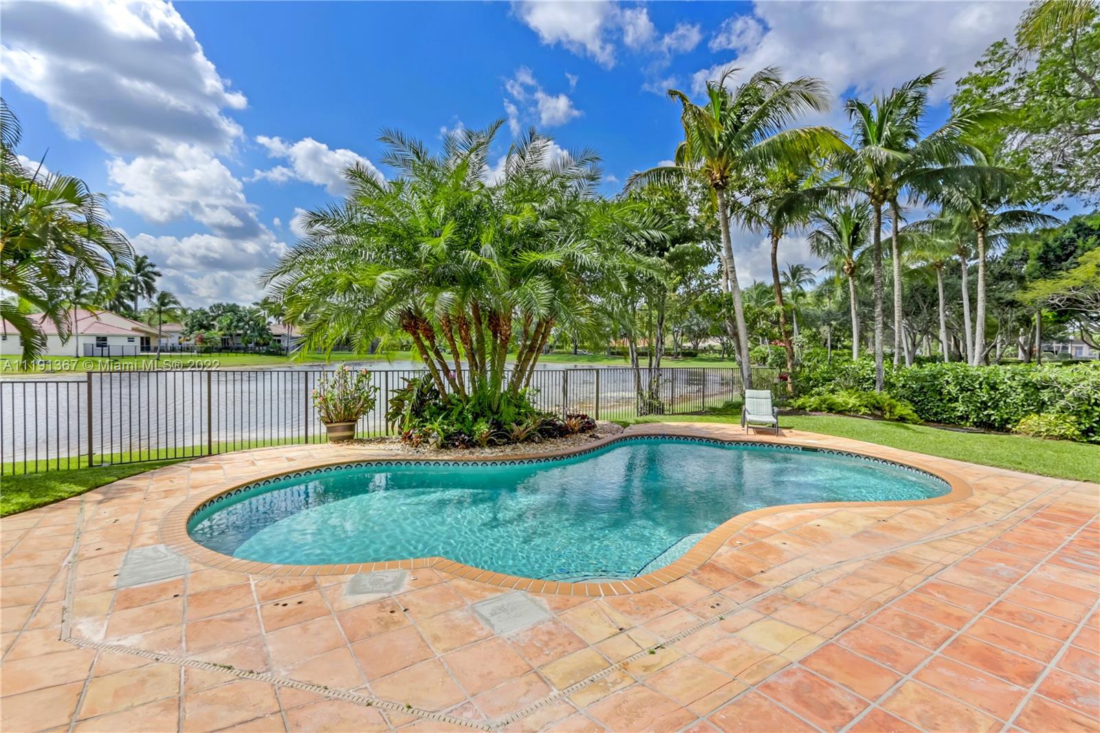 300 Mallard Road Weston, FL 33327 - Photo 8 of 46 a view of swimming pool with a yard