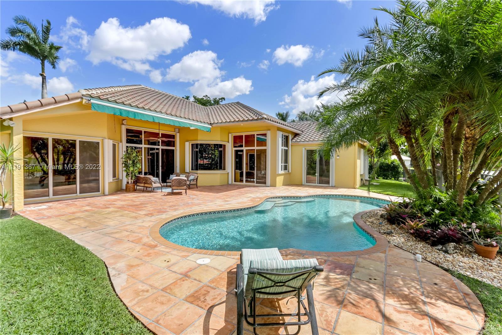 300 Mallard Road Weston, FL 33327 - Photo 9 of 46 a view of a house with sitting area and garden