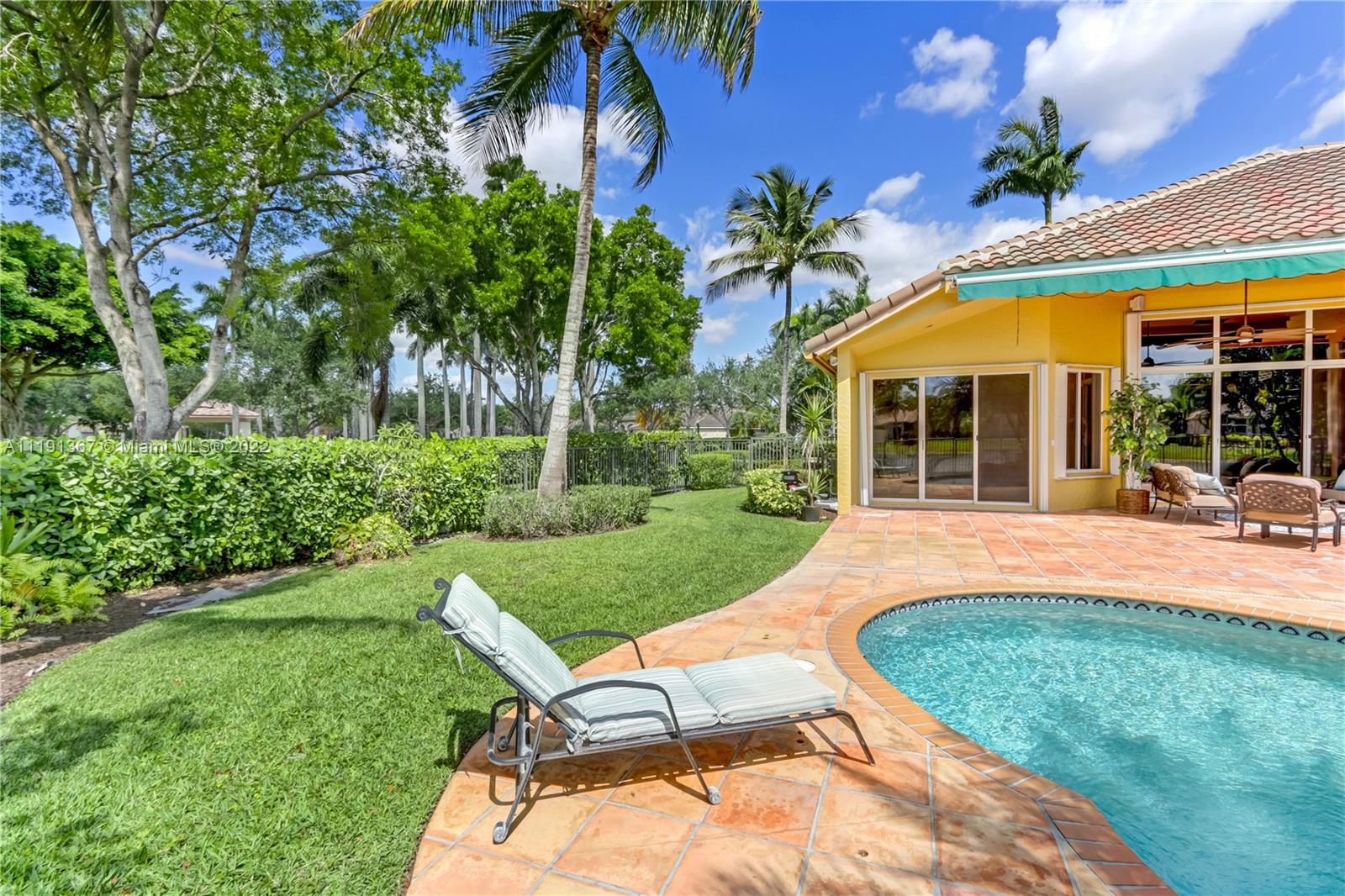 300 Mallard Road Weston, FL 33327 - Photo 10 of 46 front view of a house with a yard patio and swimming pool