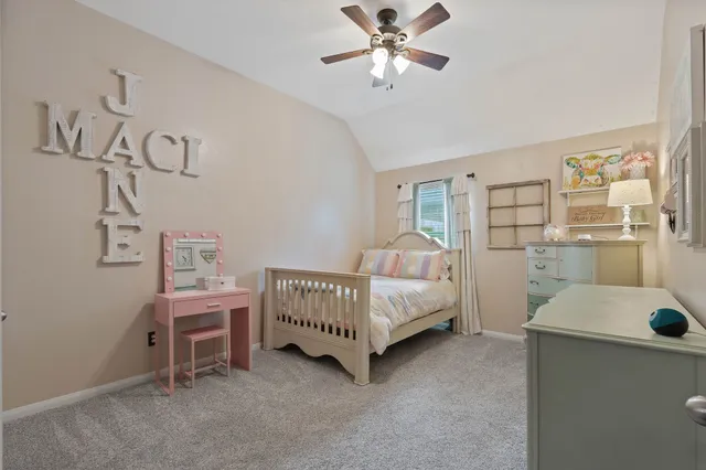 a room with a bed and a chandelier