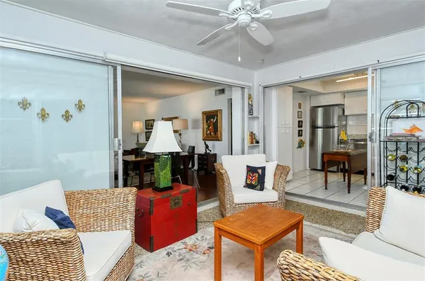 a kitchen with stainless steel appliances granite countertop a sink stove refrigerator and white cabinets