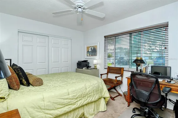 a bedroom with furniture and a window