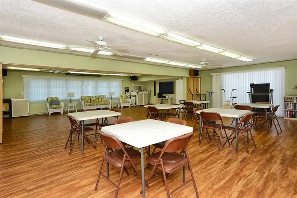 a group of people sitting at tables in a room