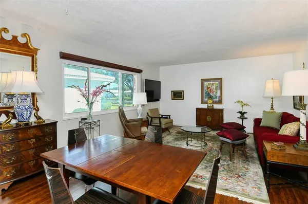 a bedroom with furniture and wooden floor