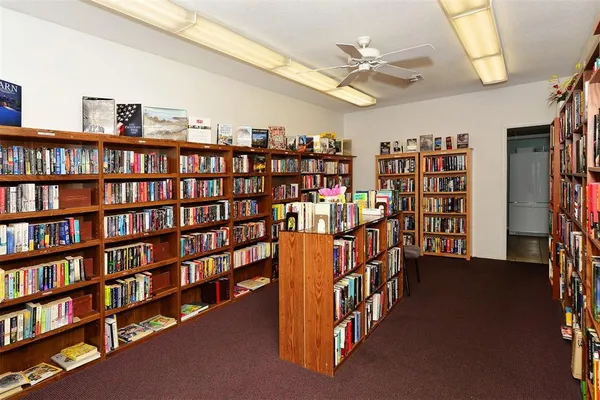 a room with gym equipment and windows
