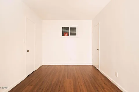 a view of a small space with wooden floor
