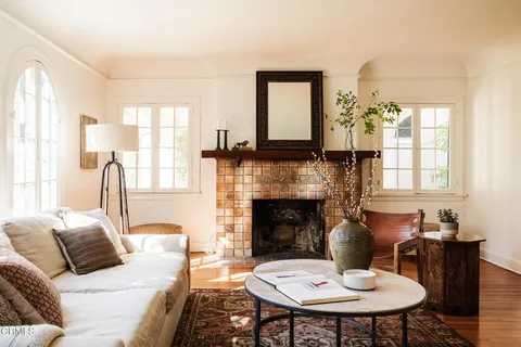 a living room with furniture and a fireplace
