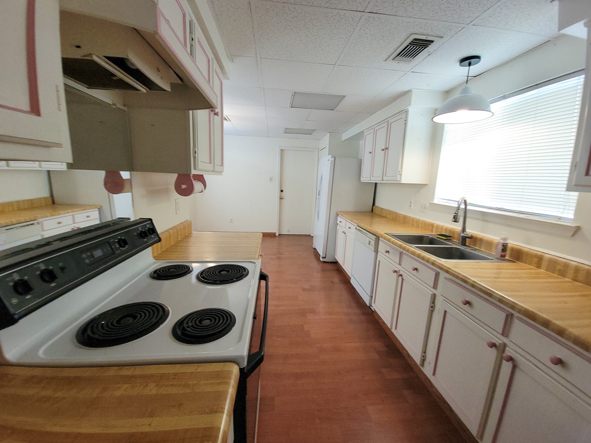 3430 Hombly Road Houston, TX 77066 - Photo 16 of 20 a kitchen with a stove and a sink