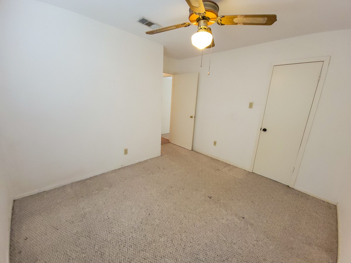 3430 Hombly Road Houston, TX 77066 - Photo 8 of 20 a view of an empty room with a chandelier fan