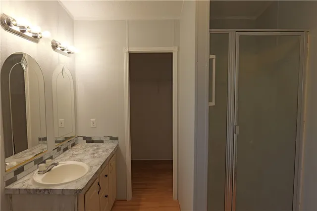 a bathroom with 2 sink and a mirror