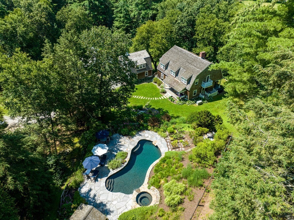 139 Stow Road Harvard, MA 01451 - Photo 1 of 42 an aerial view of a house with a yard and trees all around