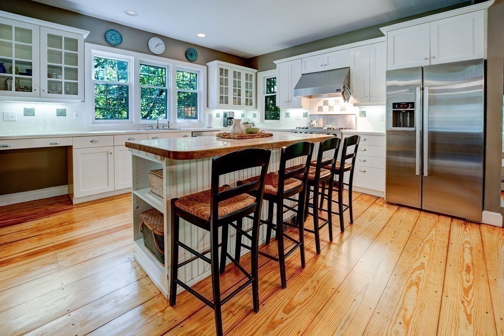 139 Stow Road Harvard, MA 01451 - Photo 11 of 42 a kitchen with stainless steel appliances granite countertop a kitchen island hardwood floor and a sink