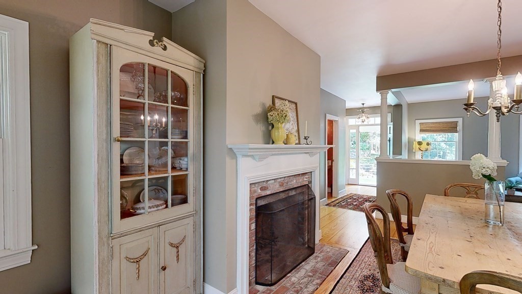 139 Stow Road Harvard, MA 01451 - Photo 13 of 42 a view of a kitchen with furniture and a fireplace