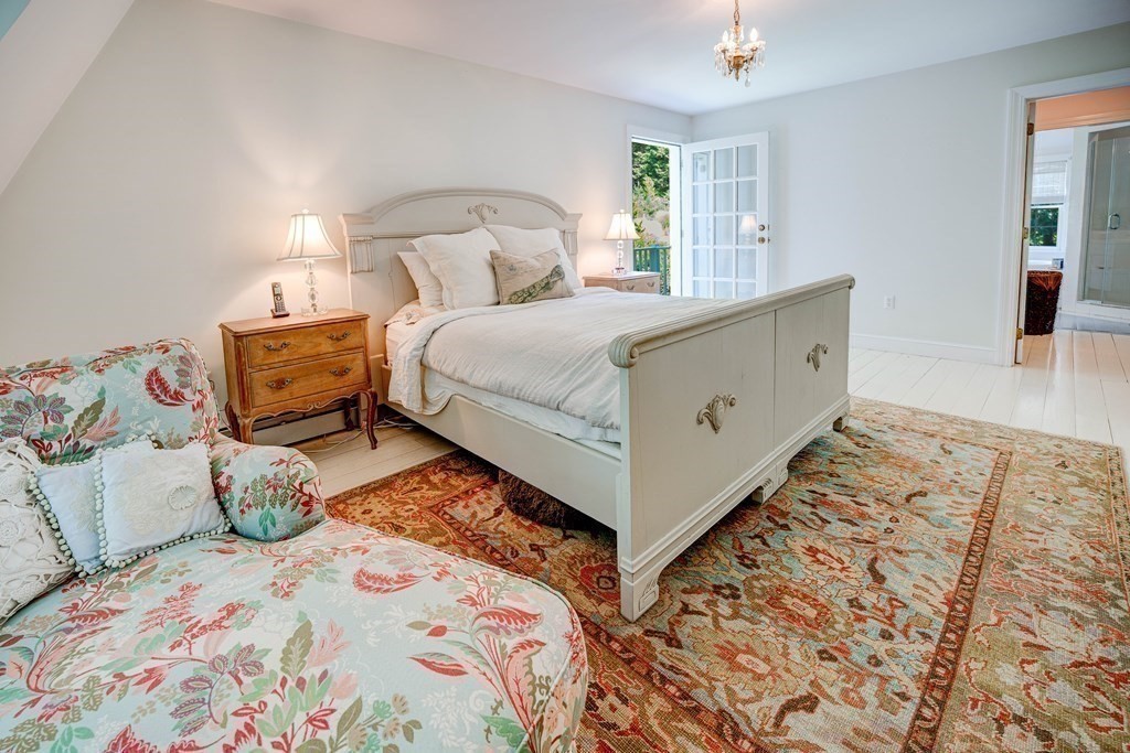 139 Stow Road Harvard, MA 01451 - Photo 20 of 42 a bedroom with a bed and wooden floor