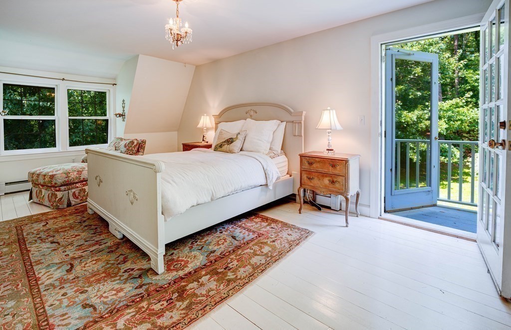 139 Stow Road Harvard, MA 01451 - Photo 21 of 42 a bed room with a bed and a chair