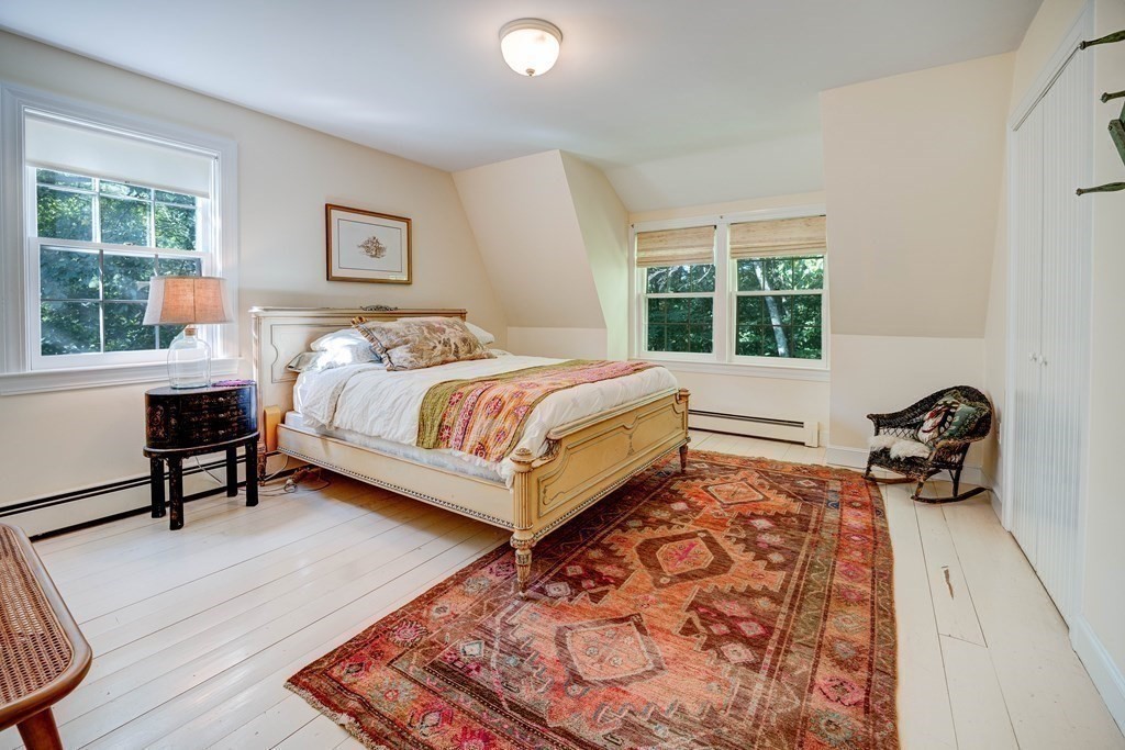 139 Stow Road Harvard, MA 01451 - Photo 24 of 42 a bed room with a bed and a chair