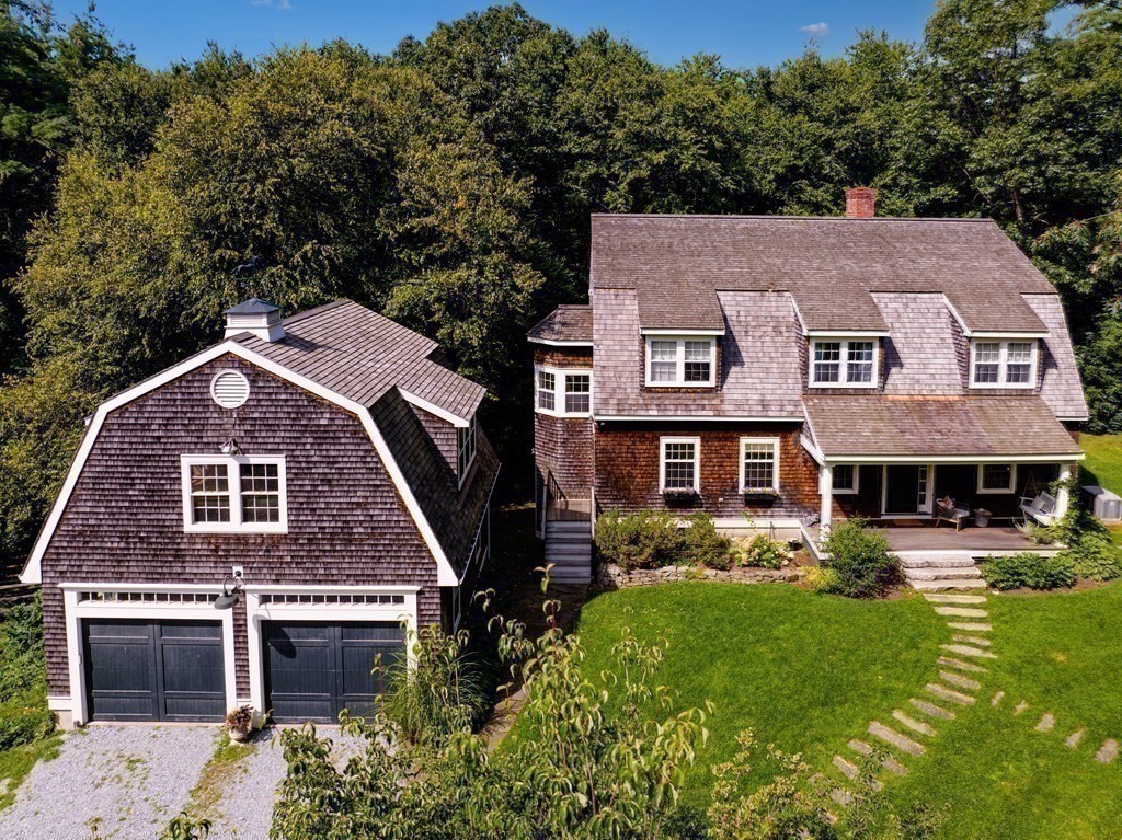 139 Stow Road Harvard, MA 01451 - Photo 30 of 42 a aerial view of a brick house next to a yard