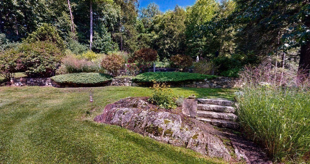 139 Stow Road Harvard, MA 01451 - Photo 35 of 42 a view of a garden with plants and large trees