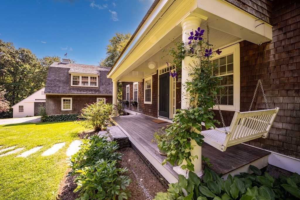 139 Stow Road Harvard, MA 01451 - Photo 4 of 42 a front view of a house with yard and outdoor seating