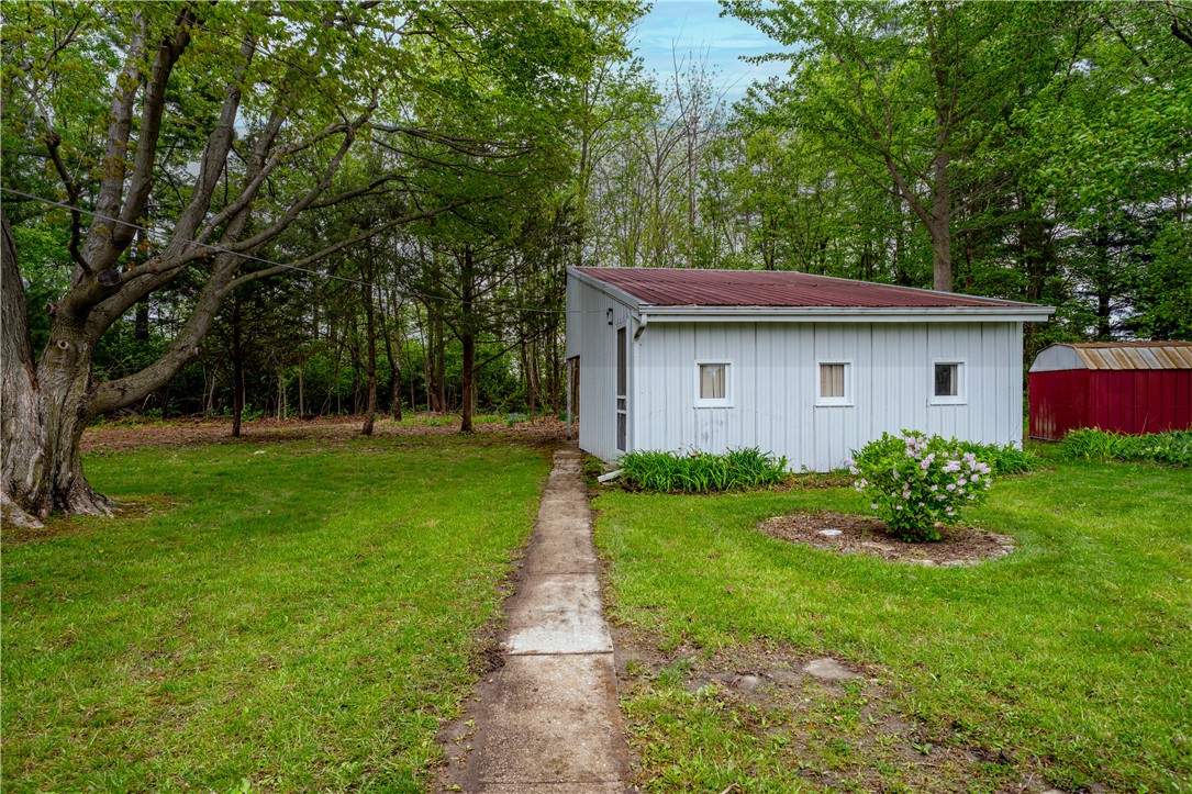 11296 Pansing Road Brookville, OH 45309 - Photo 37 of 53 A quaint outbuilding nestled in a lush, green yard offers additional space.