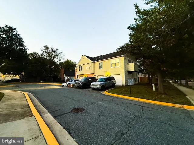 a view of backyard with swimming pool