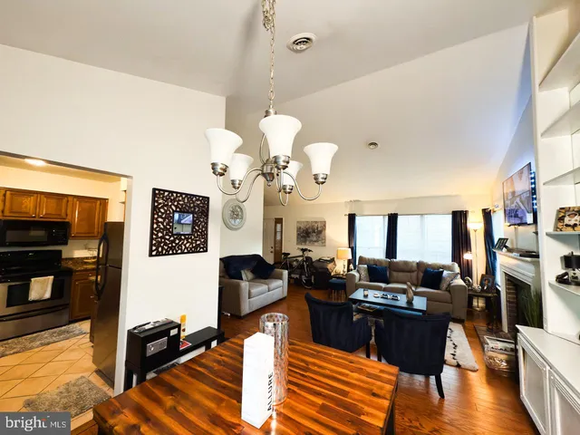 a living room with fireplace furniture and a flat screen tv