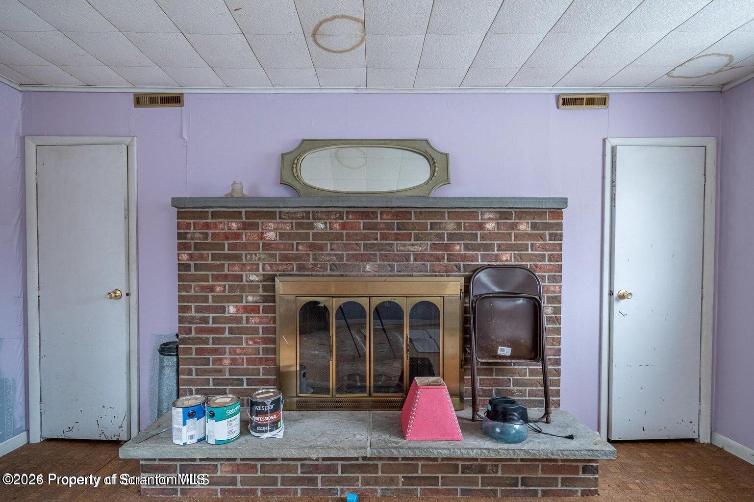 1777 Lamb Road Thompson, PA 18465 - Photo 18 of 31 a view of living room with furniture and a fireplace