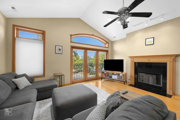 a bedroom with a bed and a fireplace