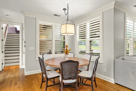 a view of a hallway with closet and stairs