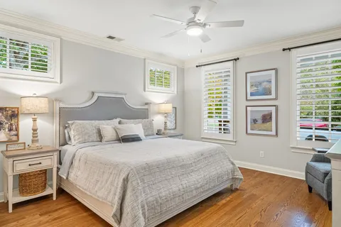 a bathroom with a tub a sink double vanity and a mirror