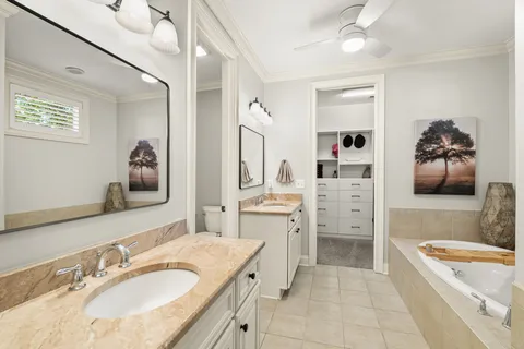 a view of a hallway with a couch and wooden floor