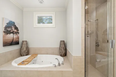 a bed room with a bed and a chair