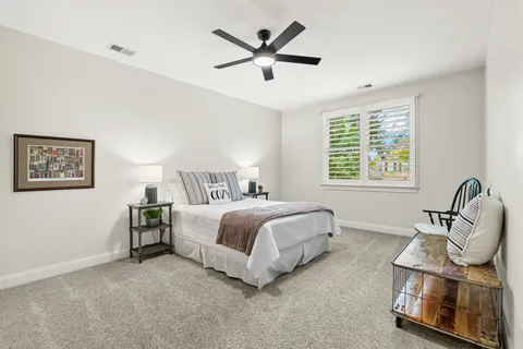 a kitchen with kitchen island a counter top space stainless steel appliances and a large window