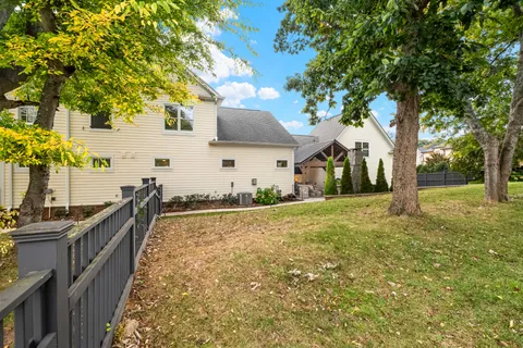 an aerial view of a house with a swimming pool