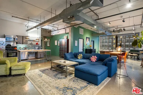 a kitchen with stainless steel appliances a sink a stove and a refrigerator