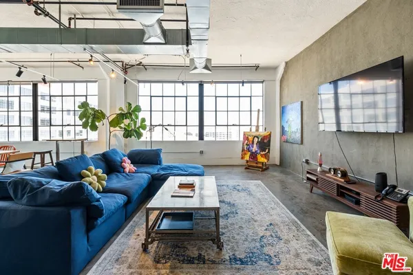 a living room filled with furniture and a couch