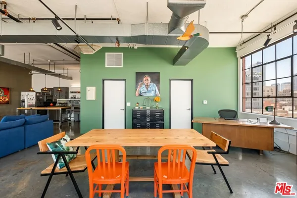 a dining area with a table and chairs in it