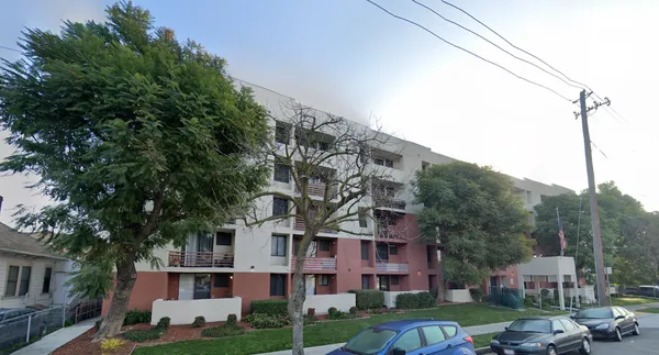 a view of a large building next to a yard