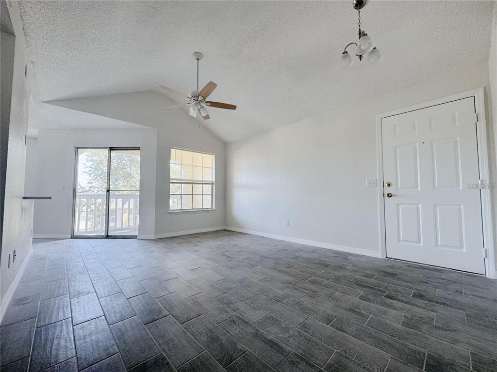 1013 South Hiawassee Road, Unit 3635 Orlando, FL 32835 - Photo 4 of 18 a view of an empty room with a window