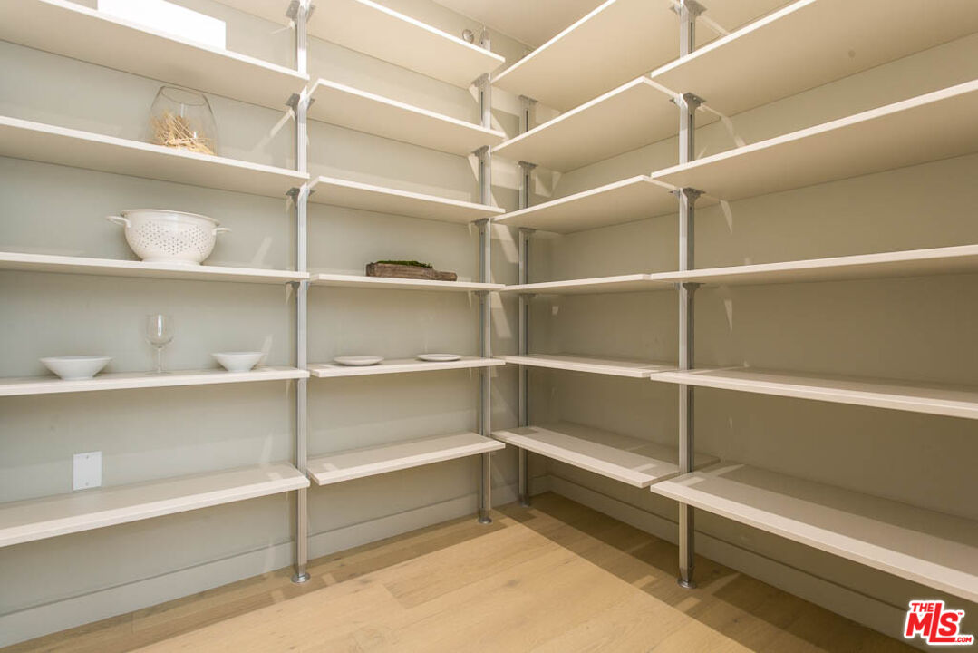 1621 Malcolm Avenue, Unit 101 Los Angeles, CA 90024 - Photo 11 of 34 a view of walk in closet with empty racks