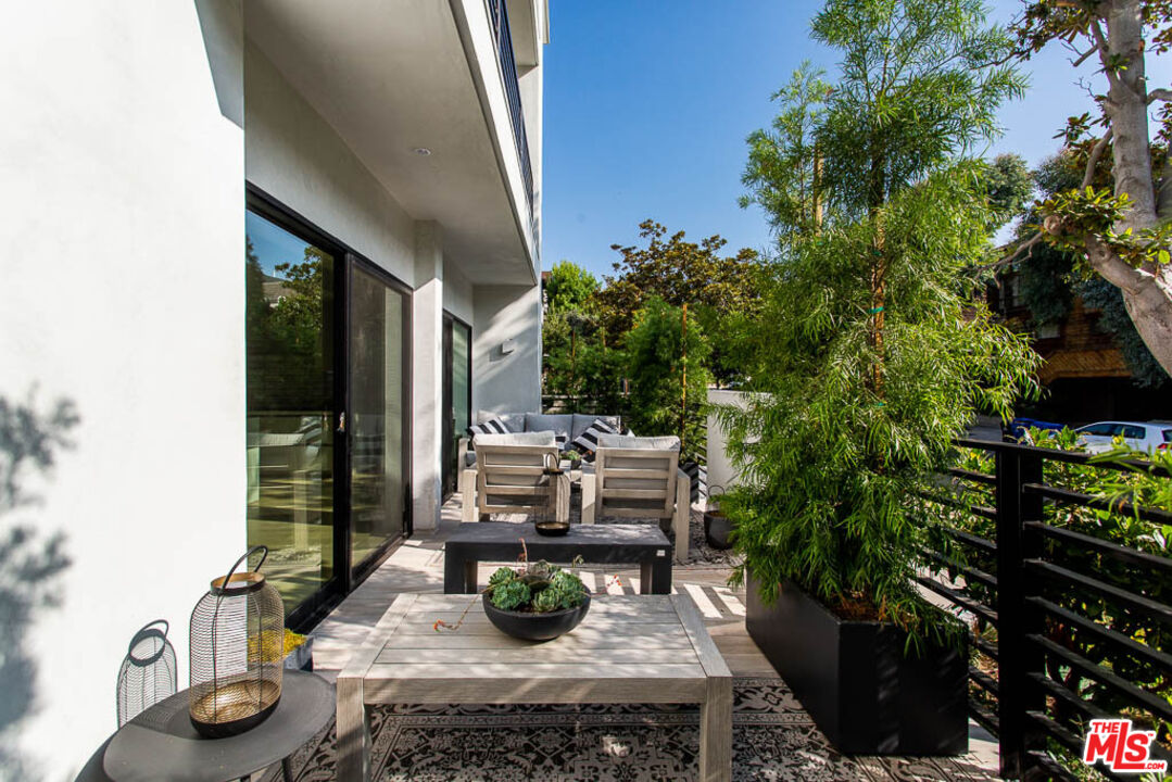 1621 Malcolm Avenue, Unit 101 Los Angeles, CA 90024 - Photo 13 of 34 a view of backyard of house with seating space