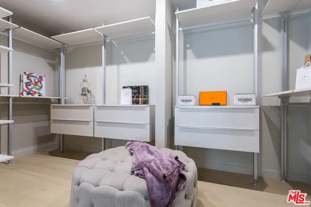 a bedroom with a bed and a cabinets